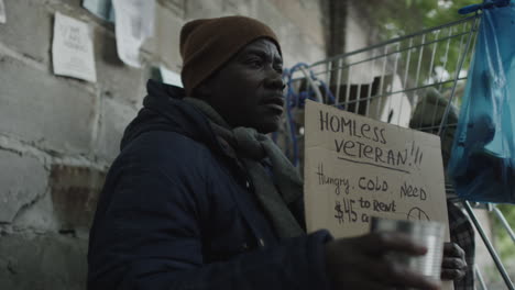 homeless veteran begging for money on the street