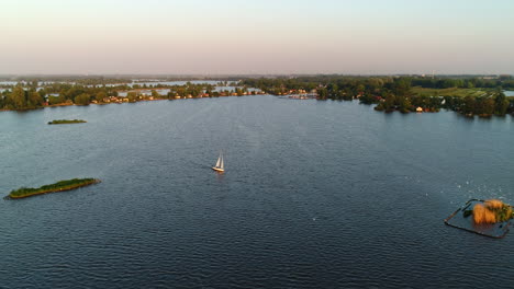 sailboat cruising at lake elfhoeven in reeuwijkse plassen, south holland