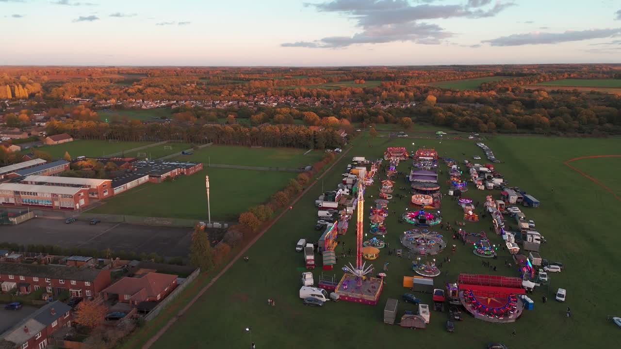 Aerial view of a fairground at sunset in Thetford, Norfolk, UK