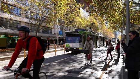 people boarding and alighting a tram