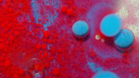 Bright-neon-colorful-bubbles-oil-and-ink,-acrylic-paint-moving-close-up,-wallpaper-background