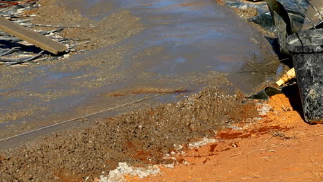 laborers building a floating concrete slab foundation on soil