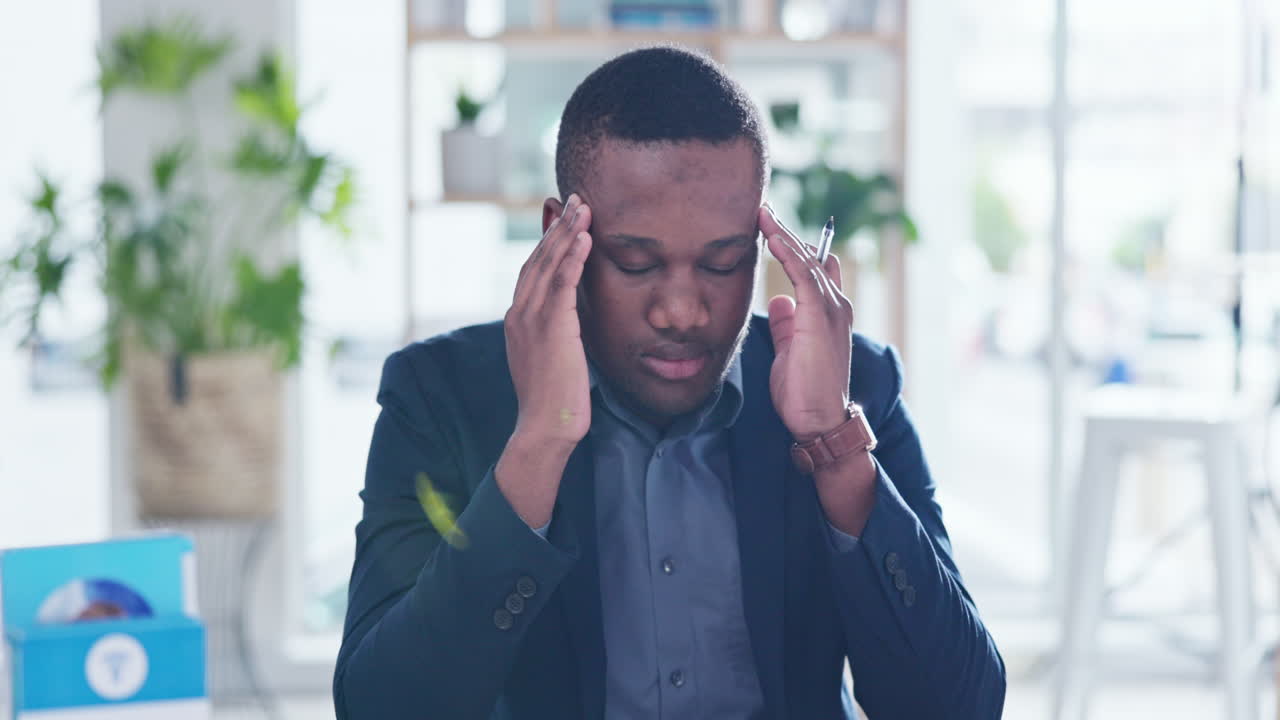 Black man, headache and pain in office