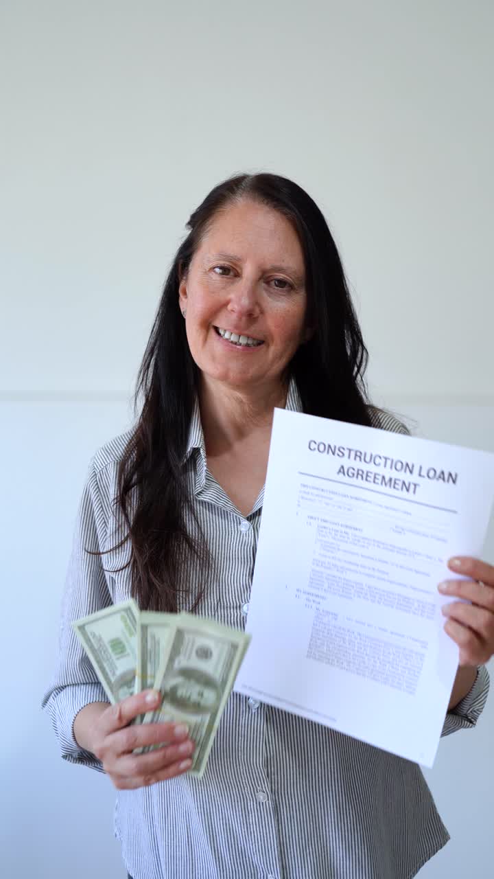 Middle age woman happy after signing a construction loan agreement. Vertical shot