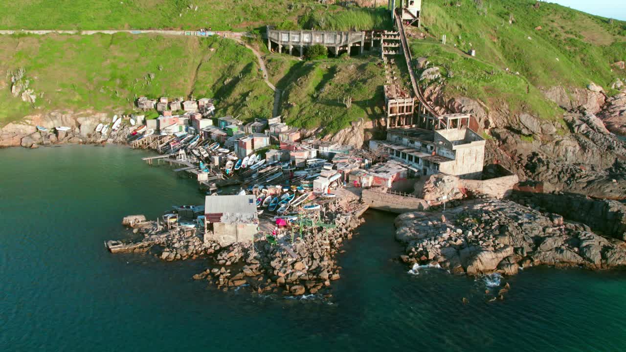 Aerial view flying towards Deck dos Pescadores, Fisherman's deck in Praia Grande, Arraial do Cabo
