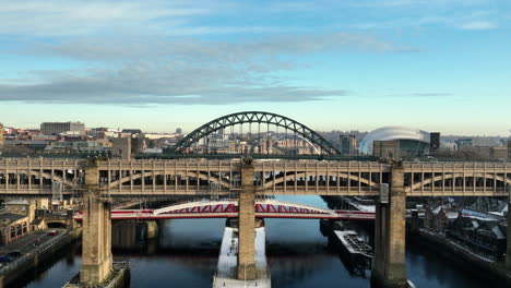 beautiful sun sets over the high level bridge as we descend to reveal the swing bridge in newcastle upon tyne