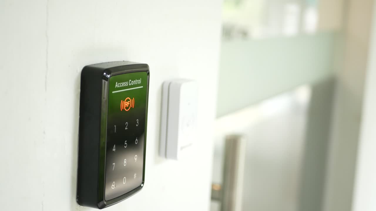 A woman presses a black doorbell