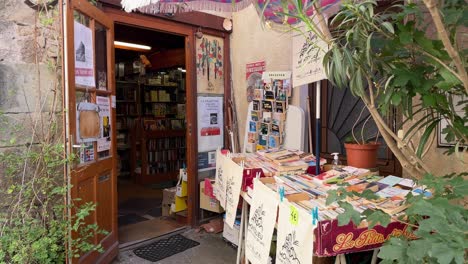 Books-displayed-at-the-entrance-of-a-bookstore-located-in-an-old-house-in-Southern-France