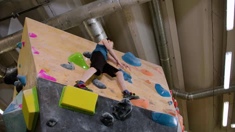 Teenage-boy-bouldering-indoors