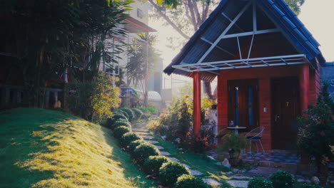 exquisite wooden house nestled in a serene garden, adorned with sunlight rays casting a captivating flare on the rocky road