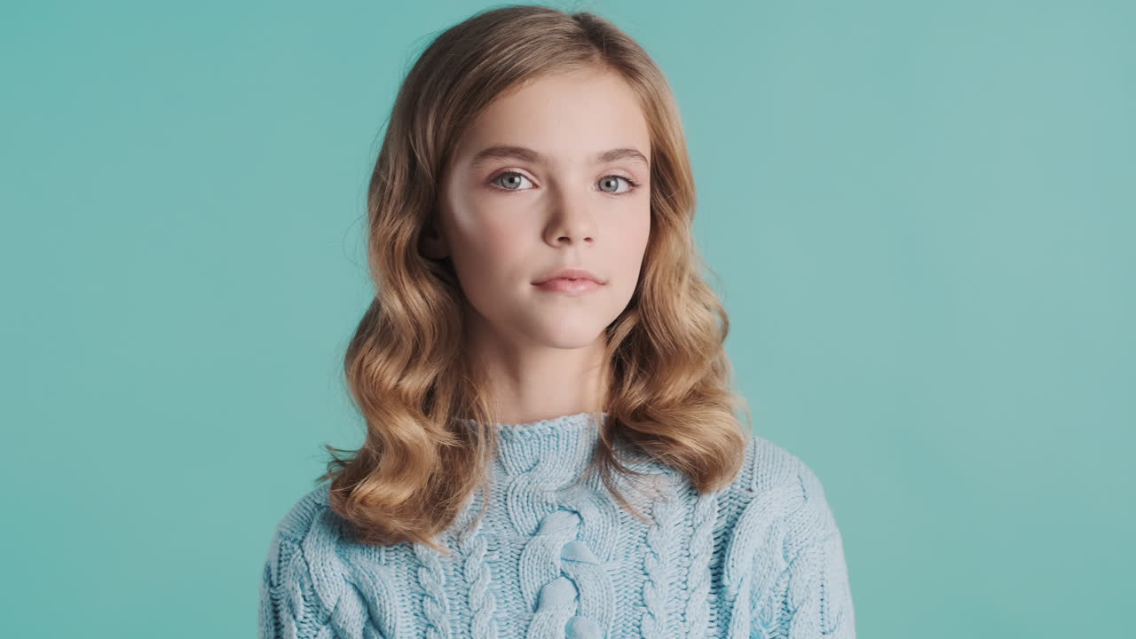 Teenage Caucasian girl looking at the camera.