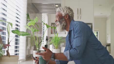 Video-of-african-american-senior-man-drinking-coffee