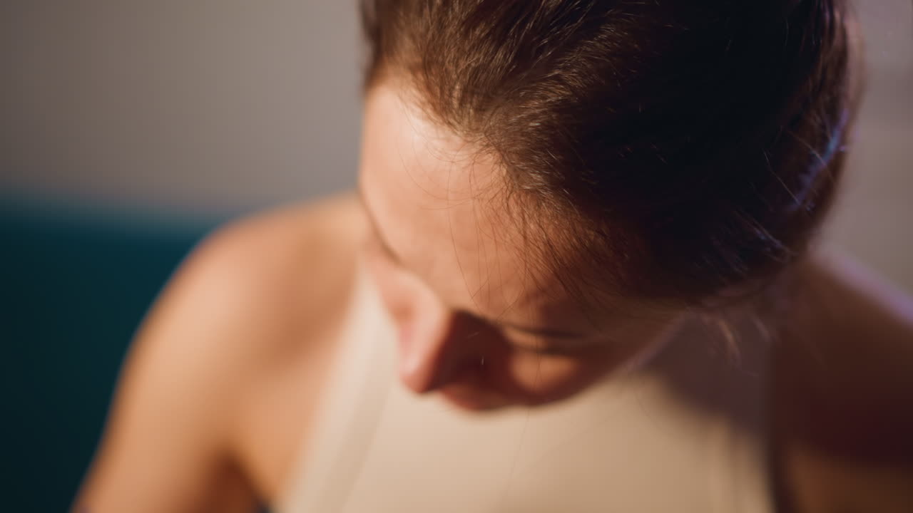 Close Portrait Of Artist Leaning Over Canvas, Caucasian Woman Studies Detail With Concentrated Expression, Soft Studio Light And Warm Tones Emphasize Dedication And Creative Focus