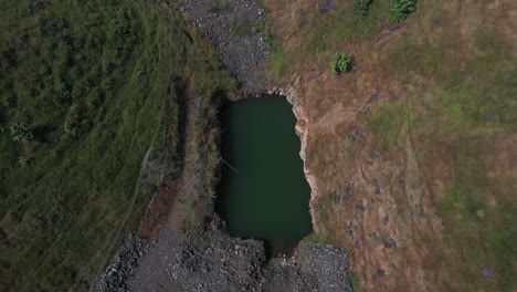 aerial: sustainable forest plantation in a valley with artificial lakes to water the plants in india