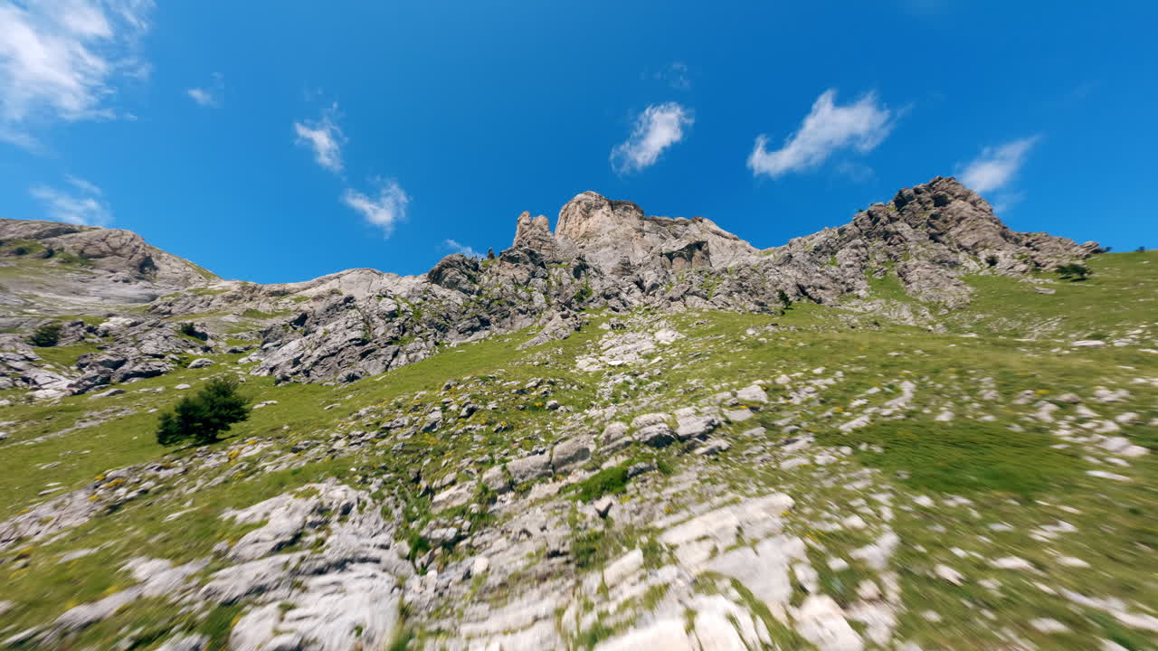 Drone view of Monte Mongioie under clear blue sky on a sunny day