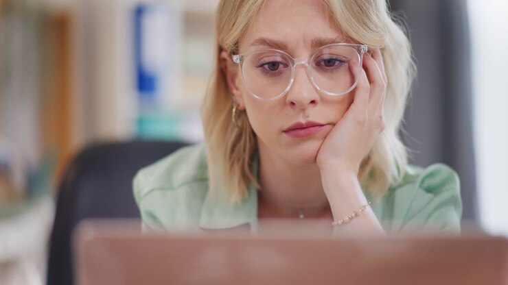 Depressed Woman Worried and Overworked in Office
