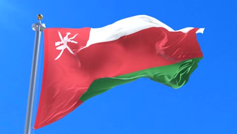 bandera de omán agitando el viento con el cielo azul en lento, bucle