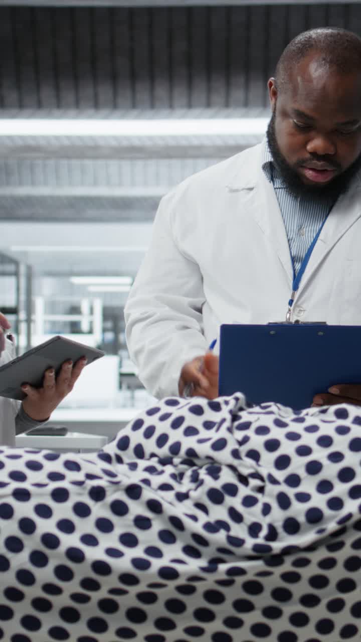 Vertical Video Medical team conducting observation and testing of a patient
