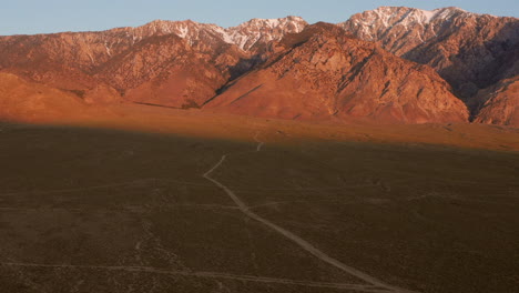 the snowy mountains of the sierra nevada during sunrise