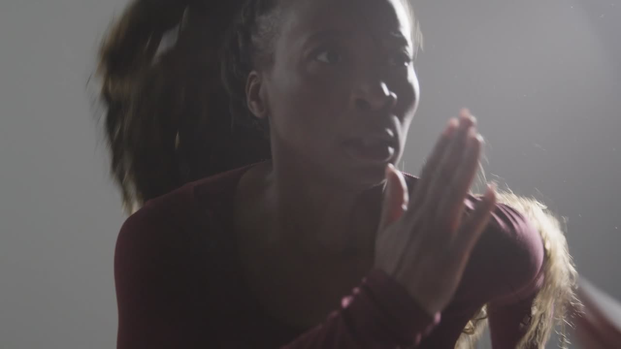 Close Up Studio Shot Of Two Women Wearing Gym Fitness Clothing Facing Each Other Exercising 3