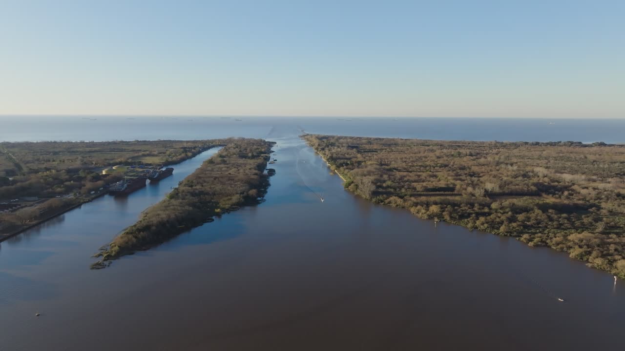 Drone footage of cargo ships sailing Río de la Plata, Argentina, highlighting import and export maritime trade