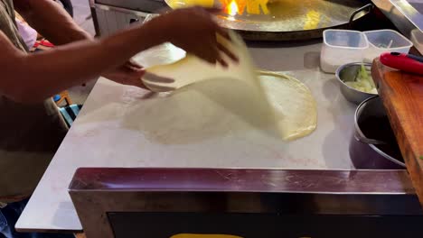 the process of cooking egg martabak