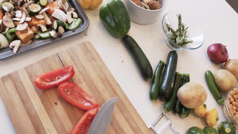 fresh vegetables are ready for chopping on a kitchen counter