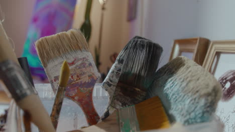 different paintbrushes in art studio