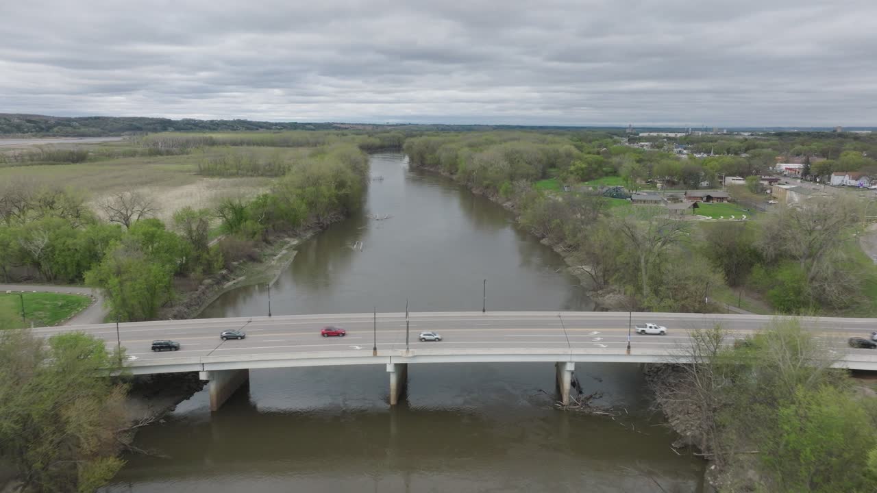 Cars Driving On The Bridge Carrying Highway 101 Over Minnesota River Near Shakopee, Minnesota, USA. - aerial shot