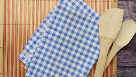 kitchen utensils and towel on placemat