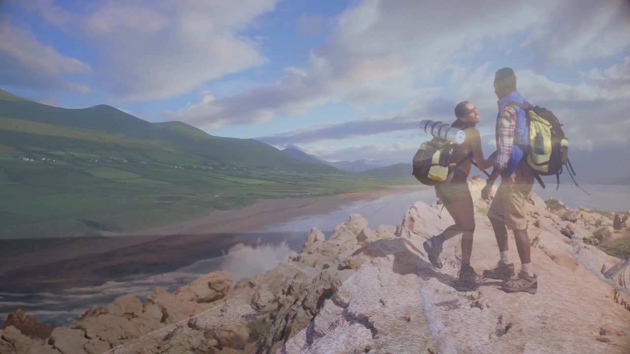 Couple hiking on coastal cliff, displaying animated heart icon and health chart overlay