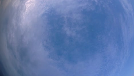 Blue-sky-and-layer-of-clouds-moving-about-in-a-fine-sunny-afternoon