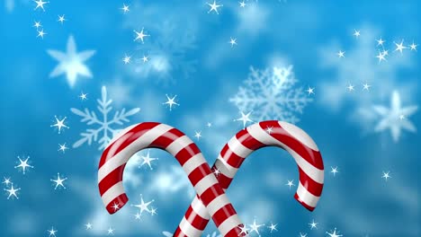 digital animation of multiple stars falling over christmas candy canes against snow flakes moving on