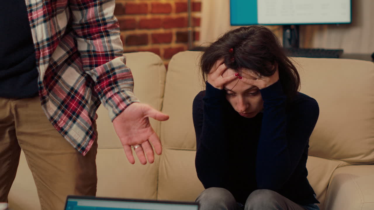 Unhappy woman attending couple therapy session with husband