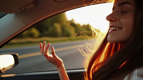 woman enjoying a scenic car ride at sunset