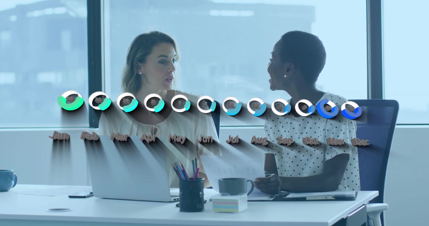 Animation of financial data and graphs over diverse female coworkers working in office