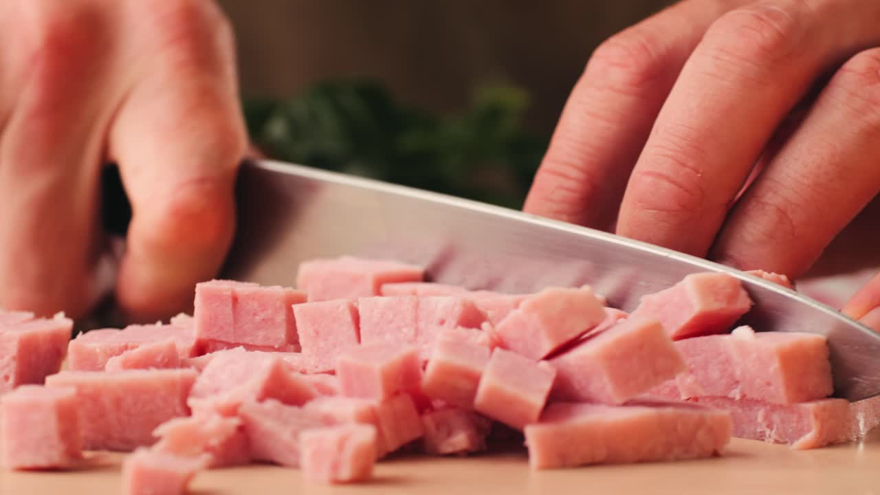 Ham italian mordatella, man Slices Of Traditional Italian antipasti mortadella sausage on a wooden cutting board, close up macro of chicken or turkey jamon, fat breakfast dish.