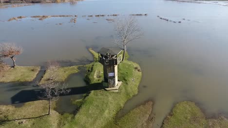 bird observation tower near lake drone footage