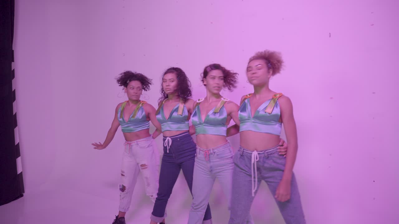 Latin dancers rehearsing on studio before the shooting