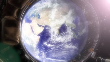 professional, photo-realistic animation of earth from the international space station. the camera slowly floats through the window out into space. clip contains, the earth, stars, space, space station