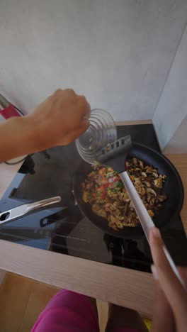 cooking stir fry in the kitchen