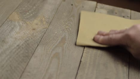 hand sanding wood with sandpaper