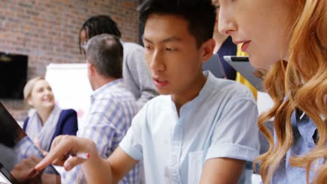 business executive using digital tablet in meeting