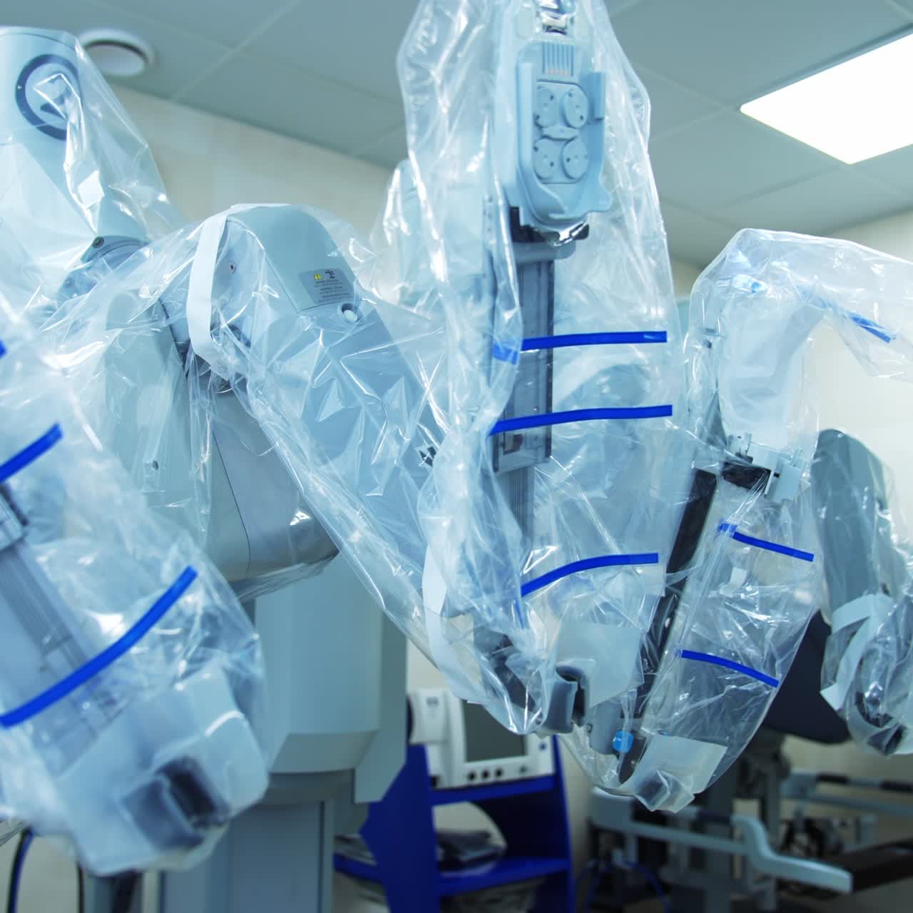 Technological high-precise equipment for surgical purposes of minimal invasion. Da Vinci robot covered with plastic for better protection and hygiene