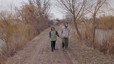 couple walking on a country path