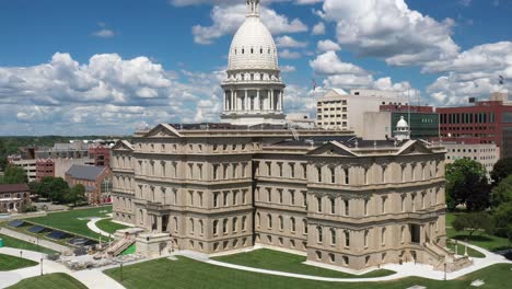 michigan state capitol building in lansing, michigan close up with clouds and drone video moving up