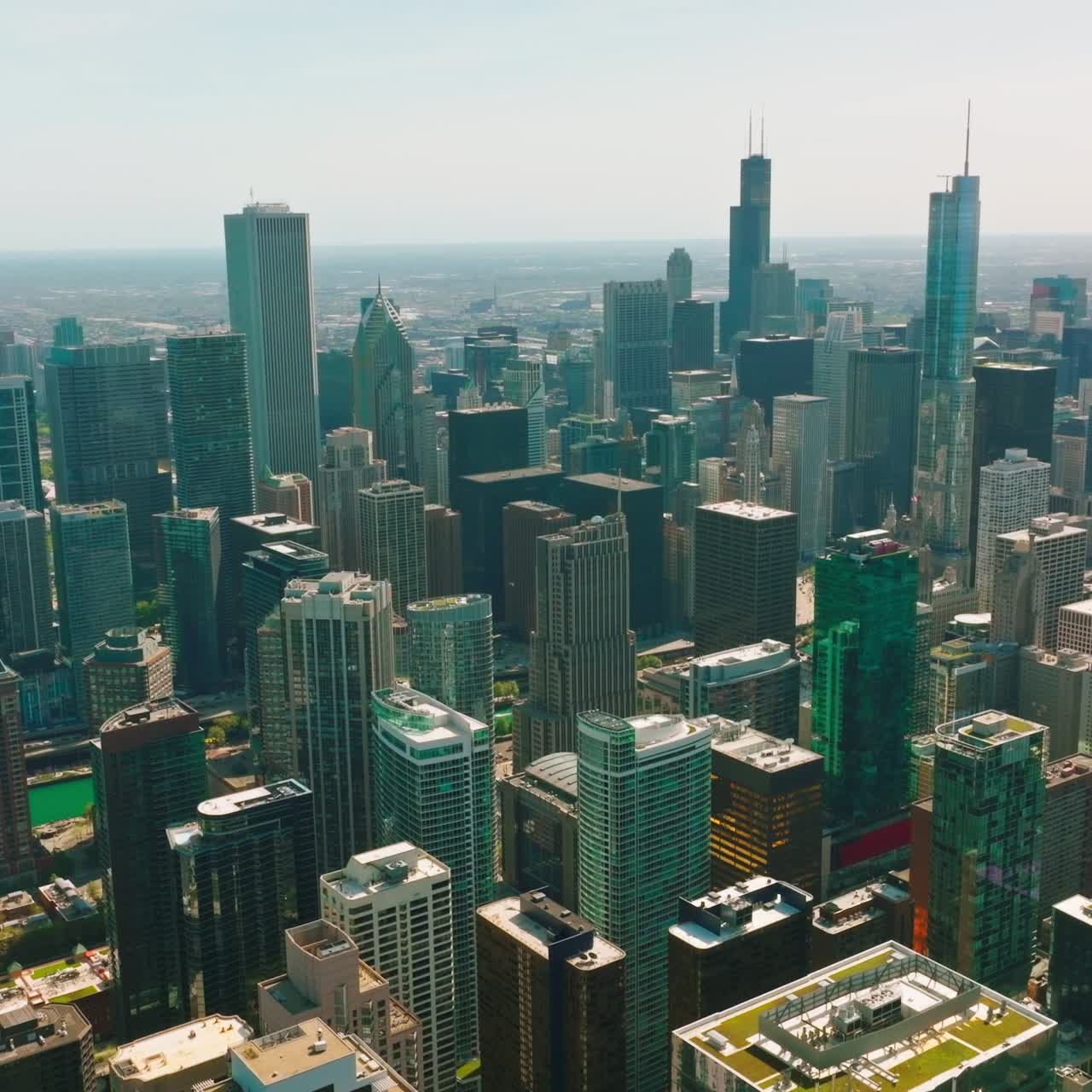 Beautiful and diverse skyscrapers of amazing Chicago, Illinois. Drone rising above the wonderful architecture. Cityscape at backdrop