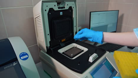 Rack with vials for sample collection. Process of testing examination by nurse medic in laboratory lab