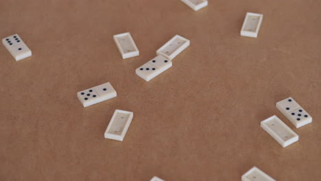 group of domino pieces falling onto table