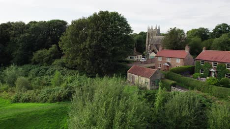 Aerial-video-footage-of-the-remains-of-Bolingbroke-Castle-a-13th-century-hexagonal-castle,-birthplace-of-the-future-King-Henry-IV,-with-adjacent-earthwork